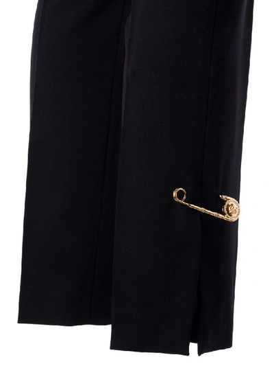 Shop Versace Button Embellished Trousers In Black
