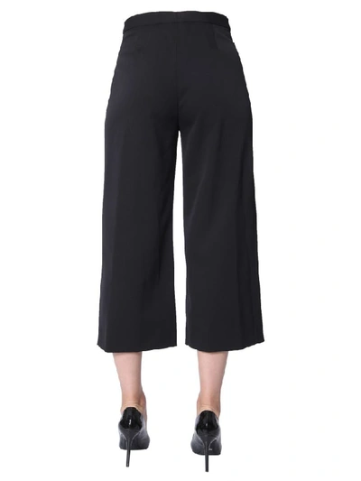 Shop Versace Cropped Trousers In Nero