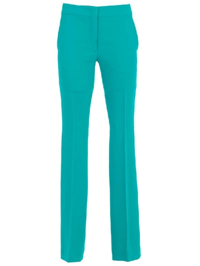 Shop Moschino Pants Flared In Green