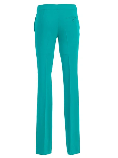 Shop Moschino Pants Flared In Green