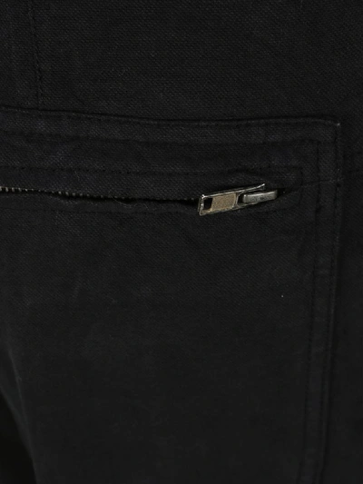 Shop Haider Ackermann Raw-hem Tapered Trousers In Black