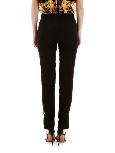 Shop Versace Safety Pin Trousers In Nero (black)
