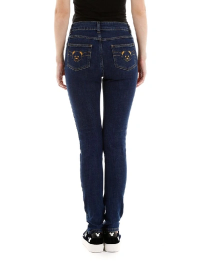 Shop Moschino Teddy Bear Jeans In Denim (blue)