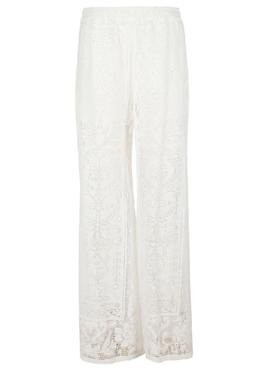 Shop Dolce & Gabbana Crochet Palazzo Trousers In White