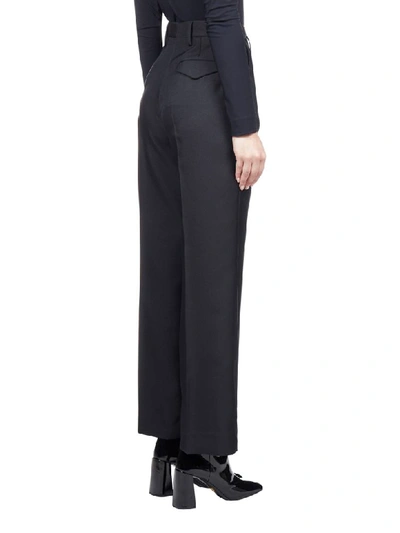 Shop Prada Trousers In Nero