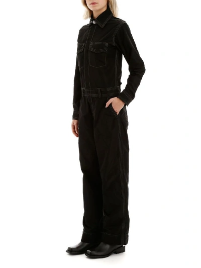 Shop Ganni Jumpsuit With Embellished Button In Black (black)