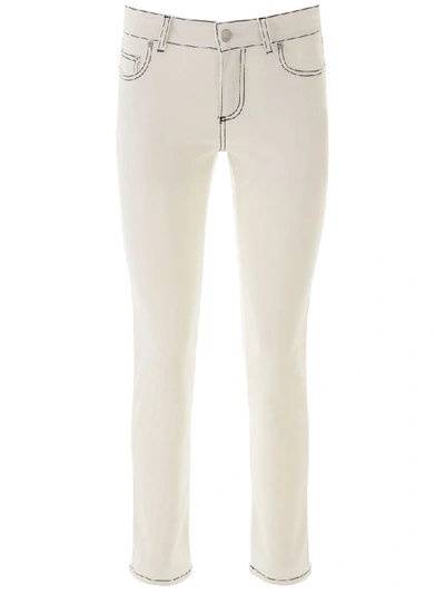 Shop Alexander Mcqueen Jeans With Contrast Seams In Chalk (white)