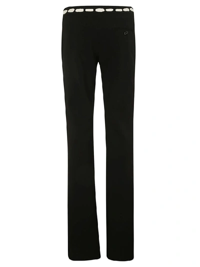 Shop Moschino Contrast Print Trousers In Black