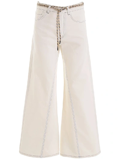 Shop Ganni Flared Jeans In White (white)