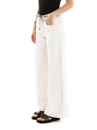 Shop Ganni Flared Jeans In White (white)