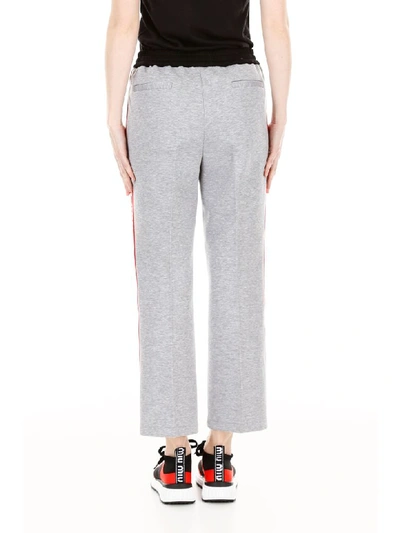 Shop Miu Miu Joggers With Logo Piping In Grigio (grey)