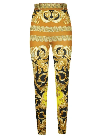 Shop Versace Baroque Print Trousers In Caramel/yellow