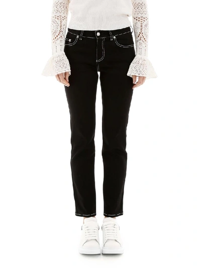 Shop Alexander Mcqueen Jeans With Contrast Stitches In Black (black)