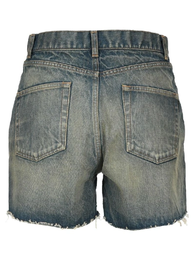 Shop Saint Laurent Raw-edge Denim Shorts In Blue Dirty
