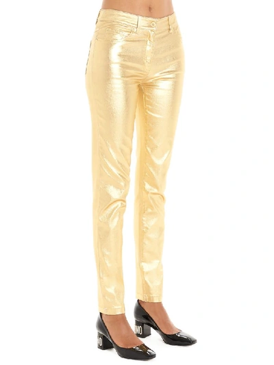 Shop Moschino Pants In Gold