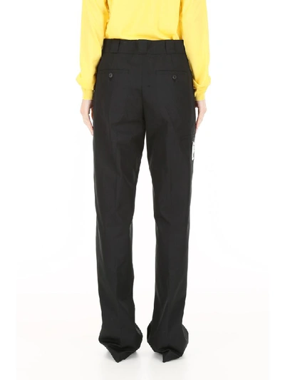 Shop Prada Palazzo Trousers With Logo Patch In Nero (black)