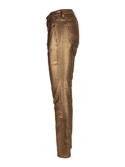 Shop Saint Laurent Jeans In Gold