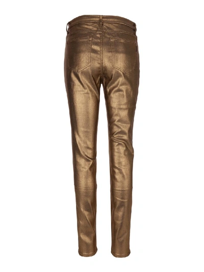 Shop Saint Laurent Jeans In Gold