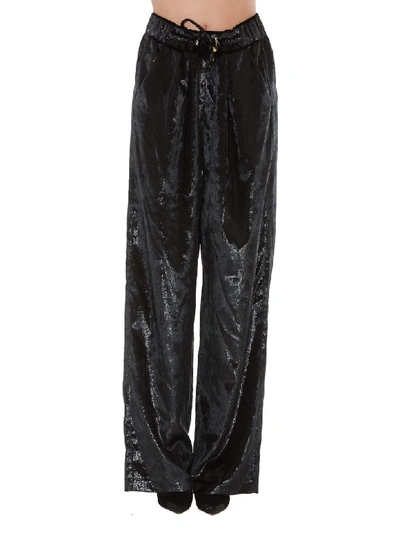 Shop Balmain Shiny Effect Trousers In Black