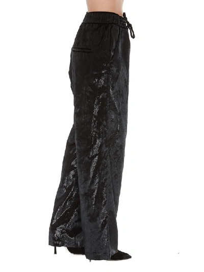 Shop Balmain Shiny Effect Trousers In Black