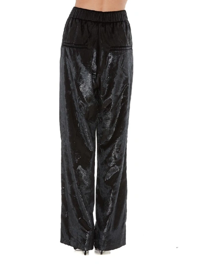 Shop Balmain Shiny Effect Trousers In Black