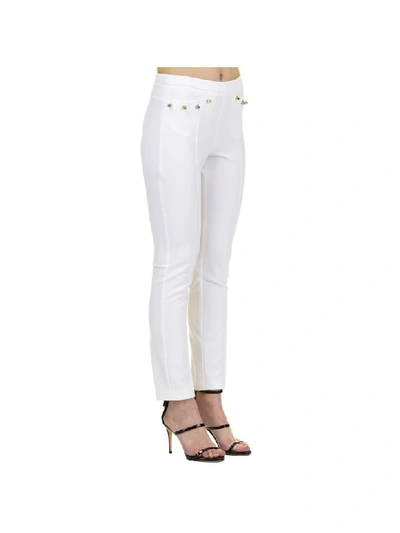 Shop Versace Trousers In Optic White