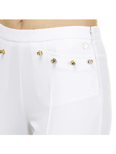 Shop Versace Trousers In Optic White