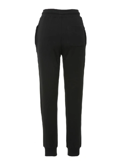 Shop Moschino Trousers In Black