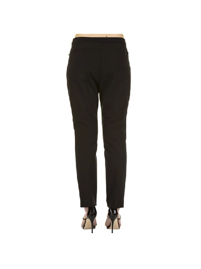 Shop Versace Trousers In Black