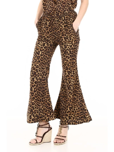 Shop Mes Demoiselles Leopard-printed Flared Trousers In Brown (beige)