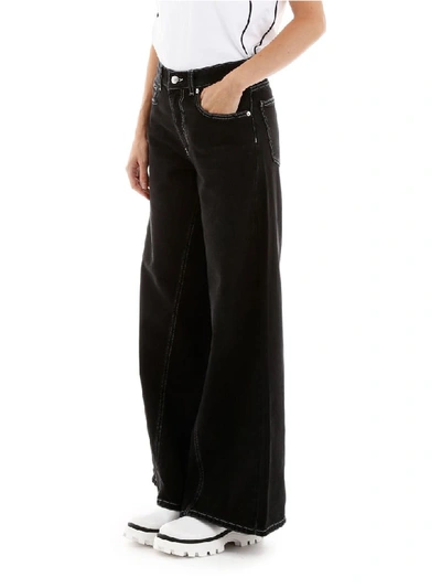 Shop Ganni Flare Jeans In Black (black)