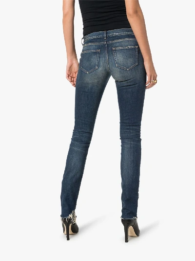 Shop Saint Laurent Low-rise Flared Jeans In Blue