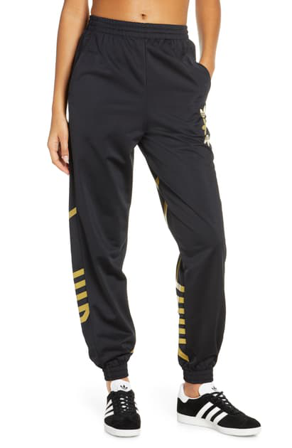 gold adidas track pants