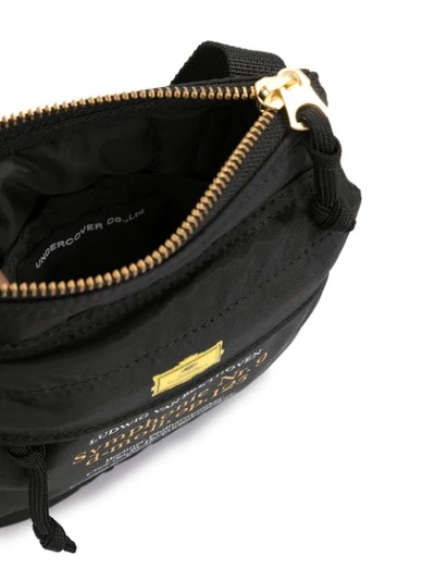 Shop Undercover Word-print Crossbody Bag In Black