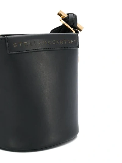 Shop Stella Mccartney Laser-cut Strap Bucket Bag In Black