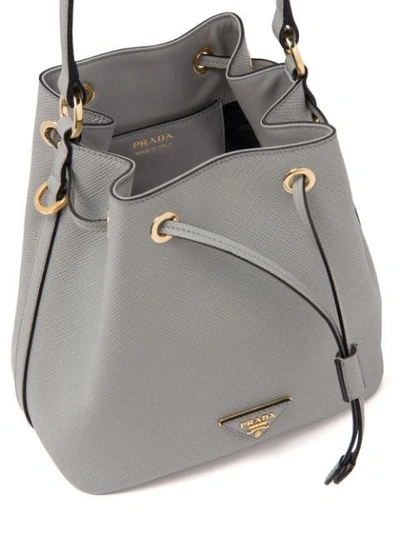 Shop Prada Saffiano Bucket Bag In Grey