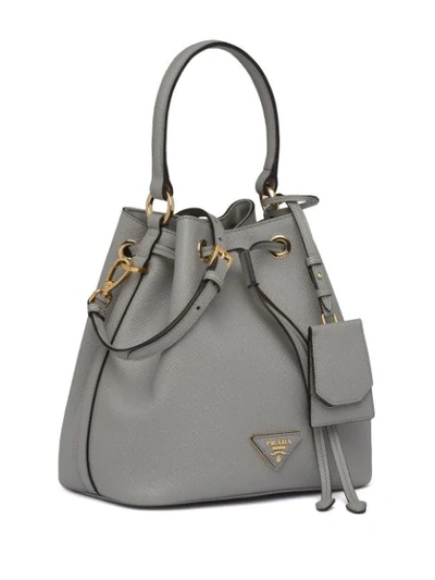 Shop Prada Saffiano Bucket Bag In Grey