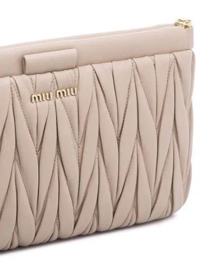 Shop Miu Miu Matelassé Leather Clutch Bag In Neutrals