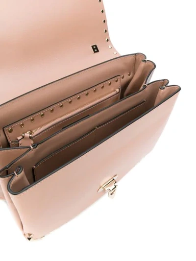 Shop Valentino Garavani Rockstud Cross Body Bag In Neutrals