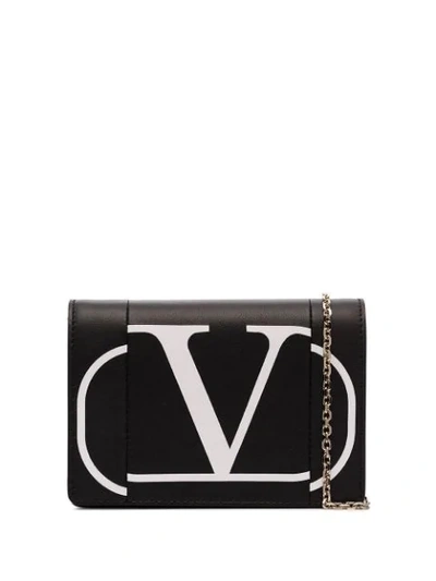 Shop Valentino Garavani Vlogo Cross Body Bag - Black