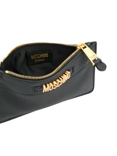 Shop Moschino Logo Plaque Clutch Bag In Black