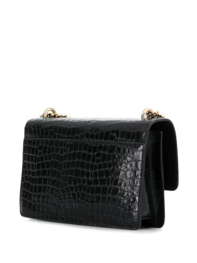 Shop Dkny Embossed Logo Crossbody Bag In Black