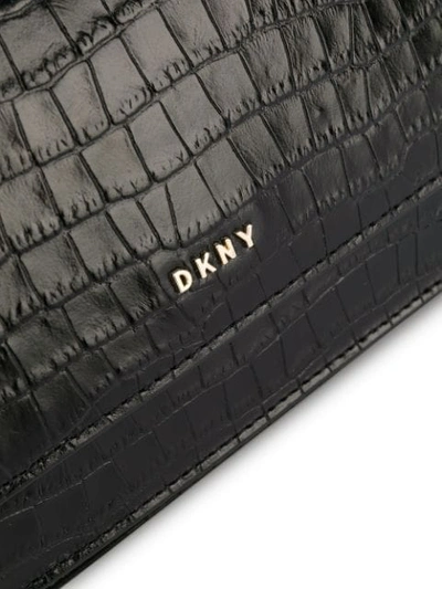 Shop Dkny Embossed Logo Crossbody Bag In Black
