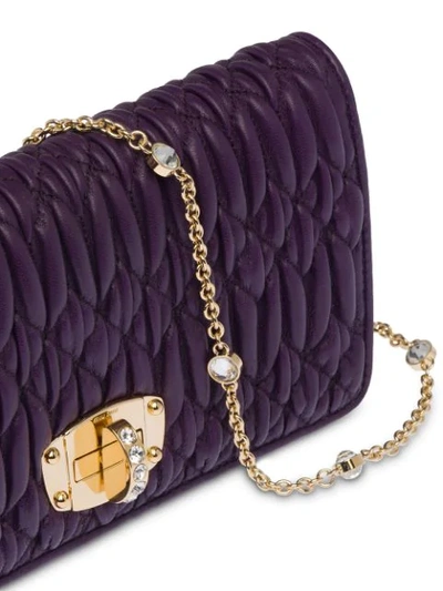 Shop Miu Miu Matelassé Embellished Cross-body Bag - Purple