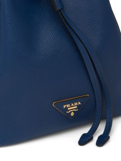 Shop Prada Saffiano Bucket Bag In Blue