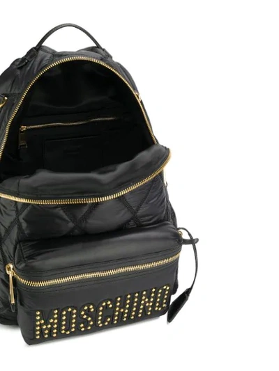 Shop Moschino Studded Logo Backpack In 1555 Black