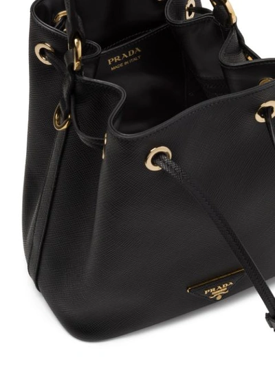 Shop Prada Saffiano Bucket Bag In Black