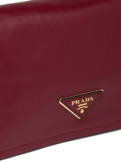 Shop Prada Logo Plaque Shoulder Bag In Red