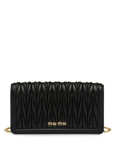 Shop Miu Miu Matelassé Lock Mini-bag In Black