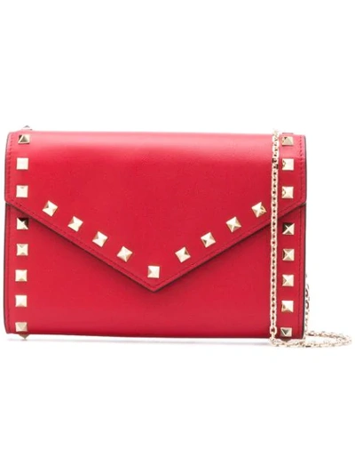 Shop Valentino Garavani Rockstud Envelope Crossbody Bag In Red